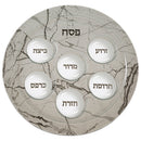 A sophisticated 40 cm glass Passover Seder plate featuring elegant gold accents and six labeled sections for the traditional Seder foods. The round glass design offers a modern yet timeless look for your Pesach table.