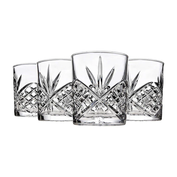 A set of four premium crystal whiskey glasses featuring a classic diamond and starburst cut, designed for an elegant and elevated drinking experience.