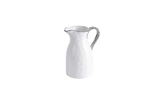  A white hammered pitcher with a gracefully curved spout and a silver-beaded handle. Its elegant and modern design makes it perfect for serving beverages in style.