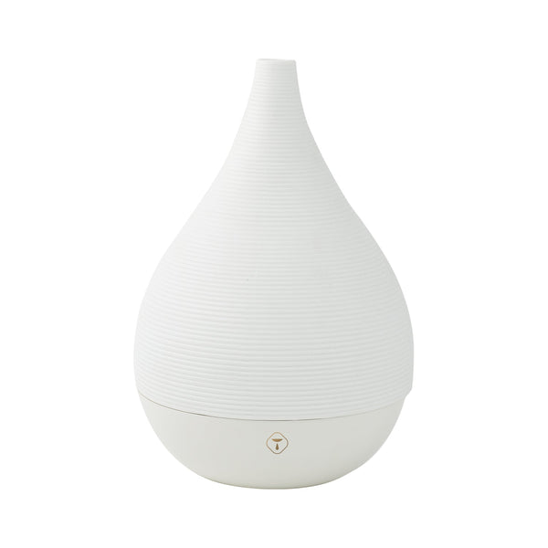 A sleek, white Trapp ultrasonic diffuser with a modern teardrop design, designed for use with essential oils.