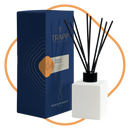Trapp No. 04 Orange Vanilla 4 fl. oz. Reed Diffuser Kit featuring a sleek white square glass bottle with black reeds, displayed next to its navy and orange packaging.