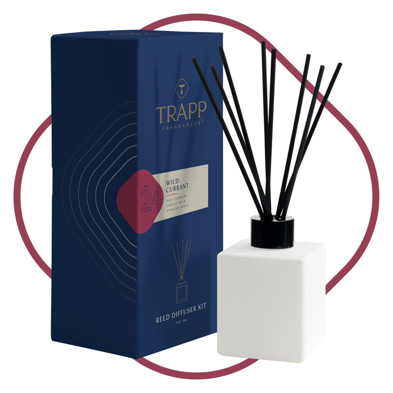 Trapp No. 24 Wild Currant Reed Diffuser Kit featuring a sleek white square glass bottle with black reeds, displayed next to its navy and red packaging.