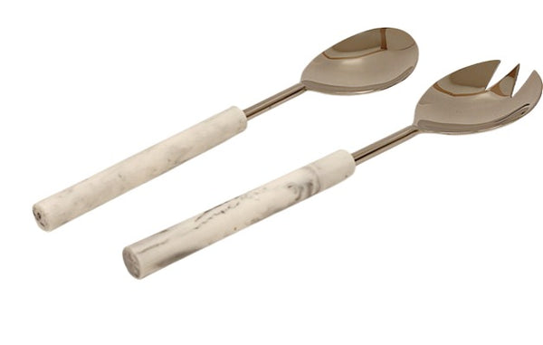 A set of two serving utensils consisting of a spoon and a fork with a modern design. Each utensil features a polished stainless steel head and a cylindrical white marble handle with subtle gray veining. The fork has a pronged edge, ideal for serving salads or pasta dishes.