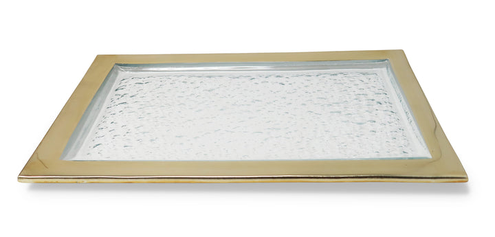 A rectangular glass serving tray with a textured surface and a gold-tone border. The elegant design combines a clear glass center with a metallic frame, making it ideal for serving appetizers, desserts, or decorative use.