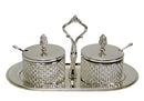 A silver-plated dish set featuring two intricately designed crystal containers with matching lids, a decorative carrying handle, and an elegant silver tray.