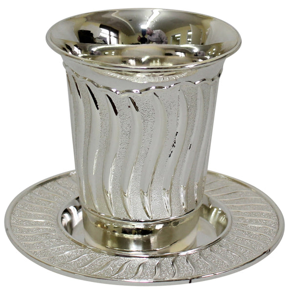 A silver Kiddush cup with a matching plate, featuring an elegant swirl-patterned texture and a polished finish.