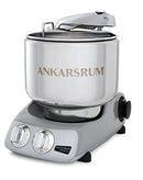 A sleek silver Ankarsrum mixer with a large stainless steel bowl and a user-friendly control panel for baking and food preparation.
