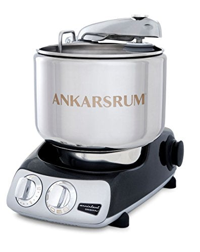 Stainless steel Ankarsrum mixer with a large bowl and black base, featuring control dials for speed and function settings.