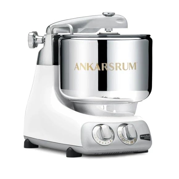 White stand mixer with a large stainless steel bowl and silver accents, featuring control knobs for various mixing speeds.