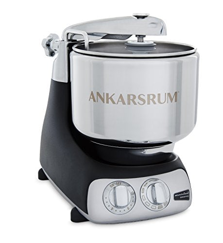 A sleek black and chrome Ankarsrum mixer featuring a large stainless steel bowl and control dials for mixing and kneading.