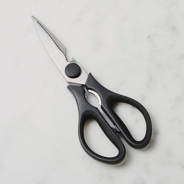 A pair of ToolSwiss black contemporary kitchen scissors with stainless steel blades and ergonomic handles, placed on a marble surface.