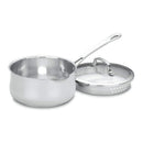 Stainless steel saucepan with its cover lying next to it on a white background