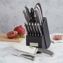 Stainless steel knives stored in a black block with cutting board and food prep setting