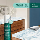 A roll of Dekal Pesach Counter Liner in a blue marble pattern, providing a fresh and modern look for kitchen surfaces. The label highlights "Blue Marble" as a new variation at the top right corner.