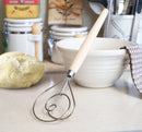 Close-up of Fox Run Danish dough whisk showing coiled stainless steel wire for mixing dough.