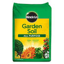 Green and yellow bag of Miracle-Gro All Purpose Garden Soil featuring sunflower, vegetables, and shrub illustrations