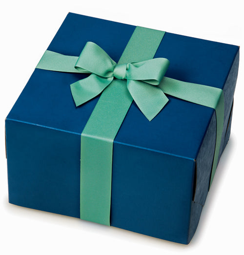 Navy blue gift box tied with a light green satin ribbon and bow