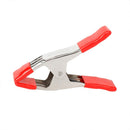 Metal spring clamp with red PVC-coated handles and jaw tips, designed for secure grip and easy handling during clamping tasks.