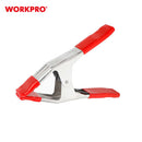WorkPro metal spring clamp with red rubber-coated handles and jaws, designed for secure gripping and holding of materials during projects.