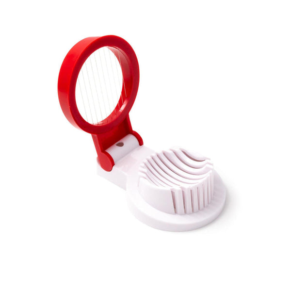White and red handheld egg slicer with a circular handle and stainless steel cutting wires, shown in an open position.