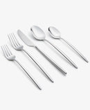 Side-angled view of flatware set arranged in a row