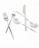 Crossed arrangement of forks, knife, and spoons on a white background