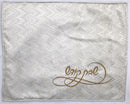 White challah cover with subtle zigzag texture and gold embroidered Hebrew text in the bottom right corner
