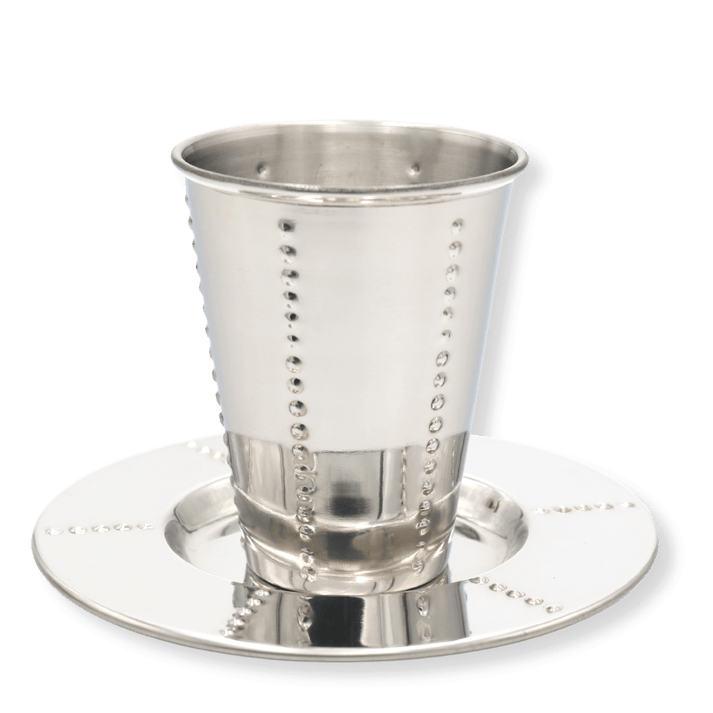 Kiddush cup and matching saucer with vertical dotted design on polished silver-tone surface