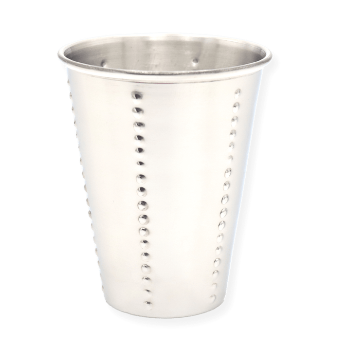 Close-up of the silver Kiddush cup showing dotted vertical pattern