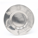 Top view of the round saucer with matching dotted accents on a smooth metallic surface