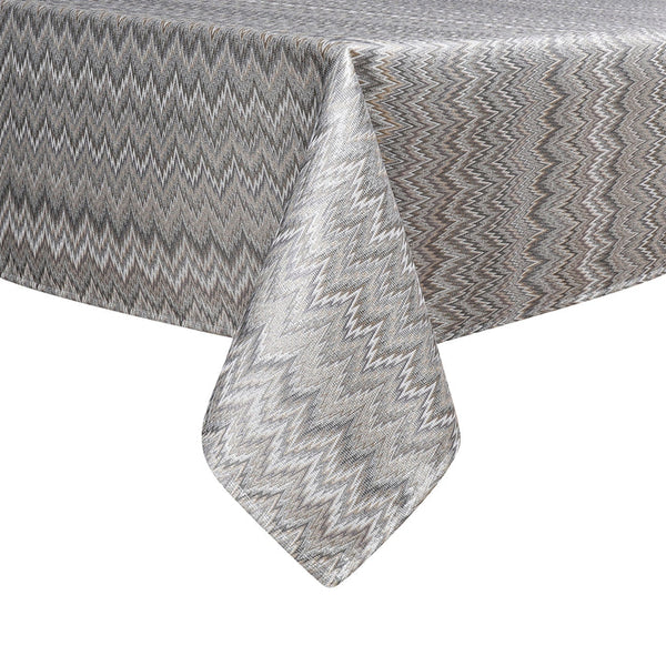 Elegant gray tablecloth with a chevron pattern, draping over the edge of a table, showcasing its textured fabric.