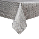 A gray, zigzag-patterned tablecloth drapes elegantly over a table, with one corner hanging down.