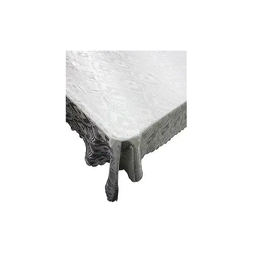 A cross-section of cured concrete showing a smooth, grey surface and a rough, darker edge, with small drips of wet concrete visible.