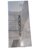Back view of Metropolitan Salad Serving Set box showing a grayscale architectural design and the Metropolitan branding.