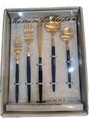 Front view of Museum Collection 20-piece gold and black flatware set inside display box.
