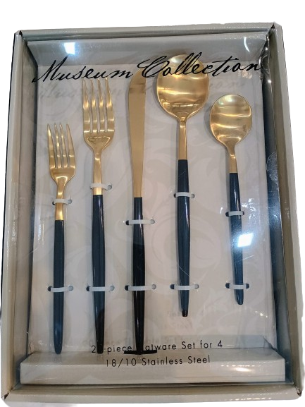 Front view of Museum Collection 20-piece gold and black flatware set inside display box.