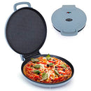 Open electric pizza maker with a fresh pizza inside and closed lid in the background