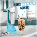 Teal Milkshake Maker Sitting on a table next to a milkshake in a glass cup with the words: 'retro milkshake maker' written on the top