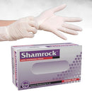 Box of Shamrock latex exam gloves with a person wearing gloves