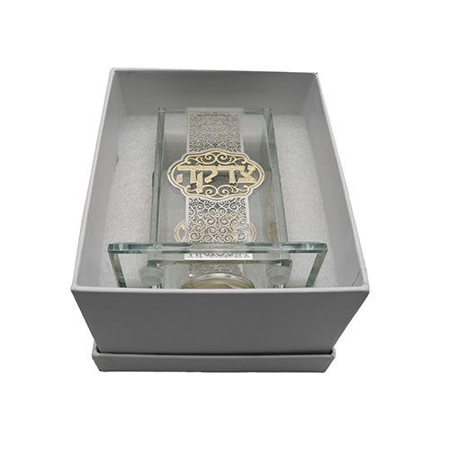Glass tzedakah box with gold plaque displayed in gift box packaging