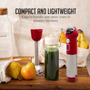Red OVENTE rechargeable hand blender standing next to fresh fruit and a smoothie jar