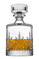 Round crystal whiskey decanter from the Godinger Dublin Collection filled with amber liquor
