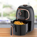 Brentwood black and copper air fryer with fries in open basket.