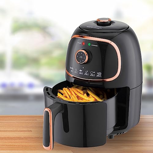 Brentwood black and copper air fryer with fries in open basket.