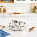 stainless steel saute pan skillet sitting on a table 