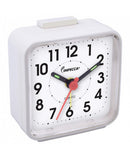 White compact travel alarm clock with black numbers and red second hand