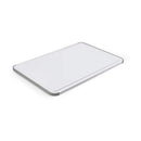 Close-up of KitchenAid large white cutting board with grey non-slip edges.
