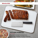 KitchenAid large cutting board with knife and sliced meat, described as a kitchen essential.