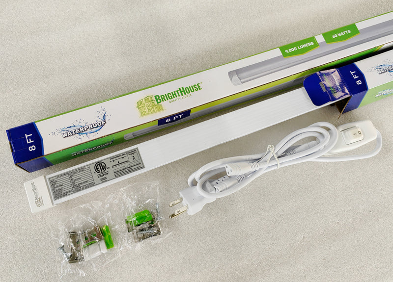 Eight-foot waterproof LED light strip with power cord, clips, and packaging displayed on light background