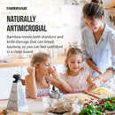 Mother cooking with children using Farberware bamboo cutting boards.